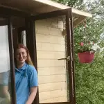 Young girl looking out window in County Antrim